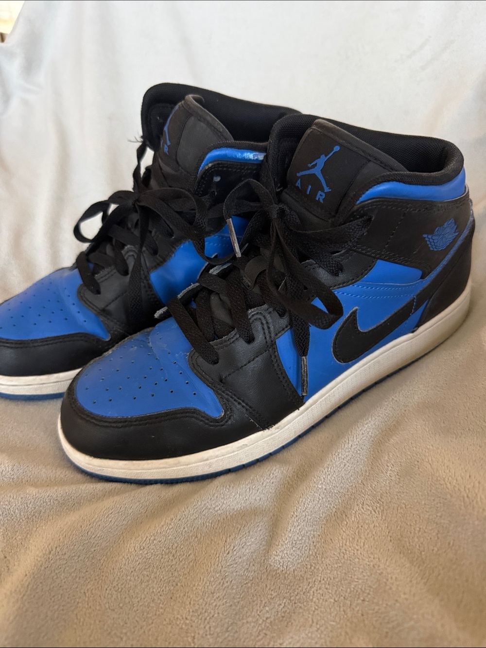 Nike Jordan 1 Mid Sneakers in Black and Blue